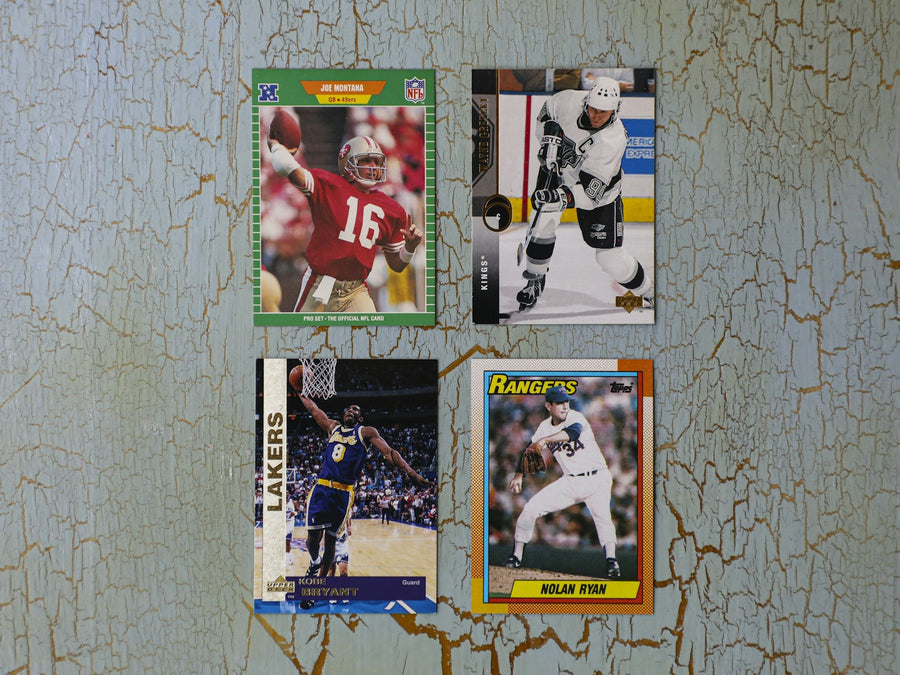 Collector desk with protected trading cards and packing supplies